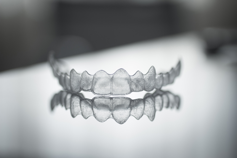 Invisalign Clear Aligners sitting on table