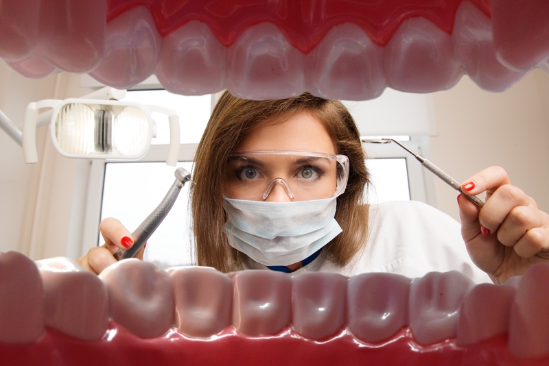 A view of a dentist from inside a patient's mouth